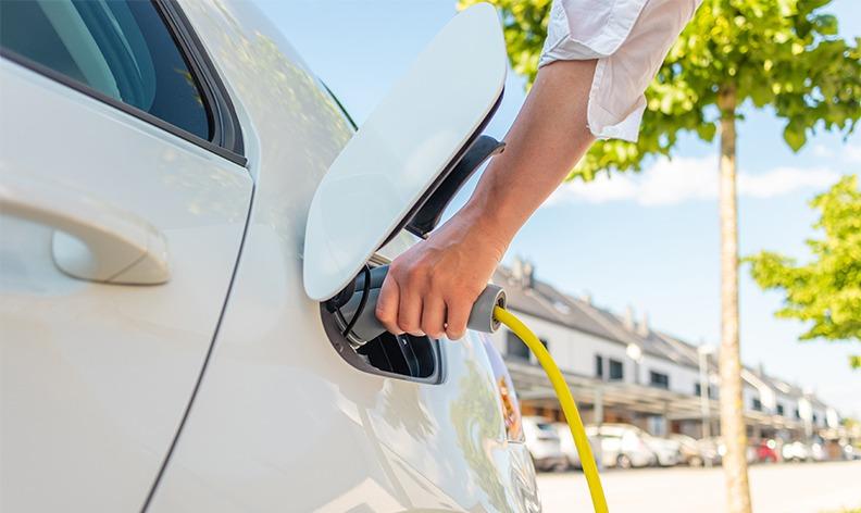 Is it better to charge an EV at home or at a public charging station?
